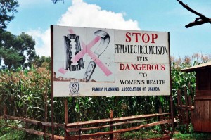 A road sign against female genital mutiliation in Uganda. Amnon Shavit, Wikimedia Commons, Creative Commons.